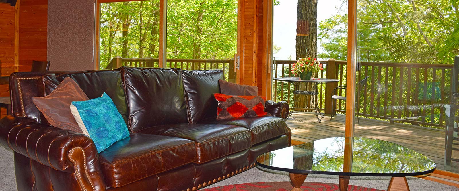 photo with view of Honeybear Chalet greatroom looking through the glass to the outside 