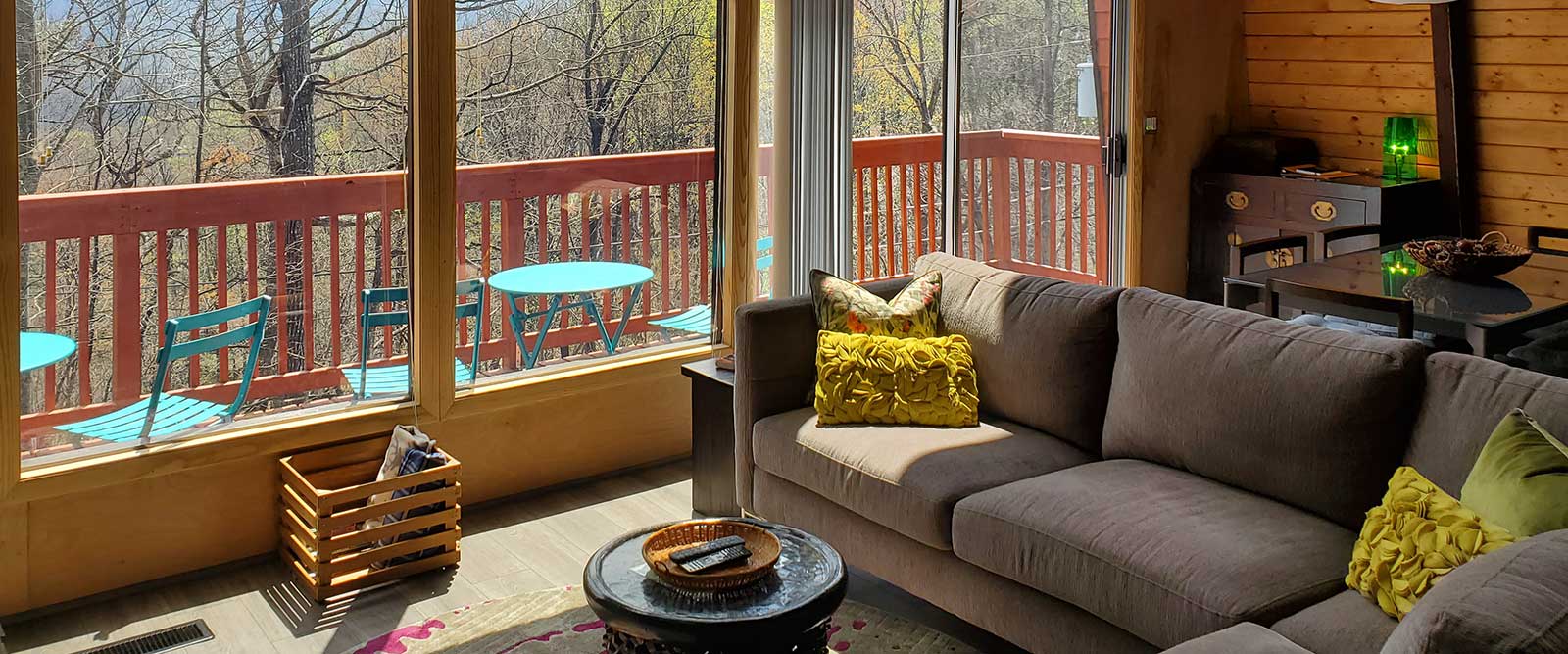 photo with view of Treetops greatroom looking through the glass to the outside 